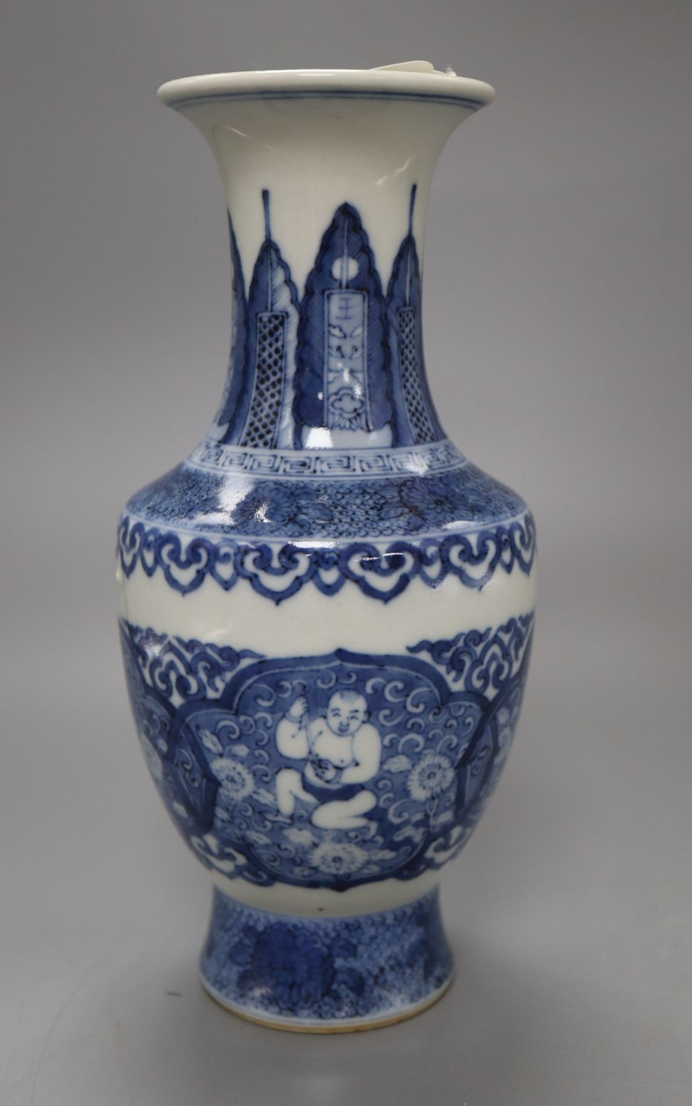 A Chinese blue and white bottle vase, bears Kangxi mark, height 22cm